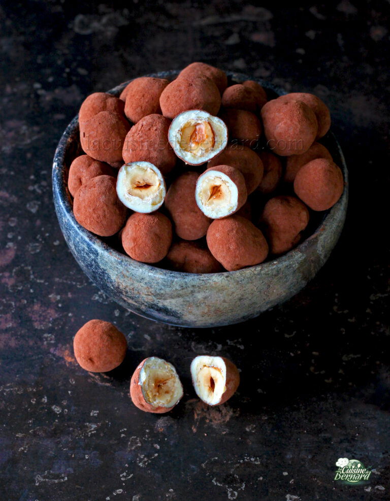 Chocolate truffles in a bowl on a table.